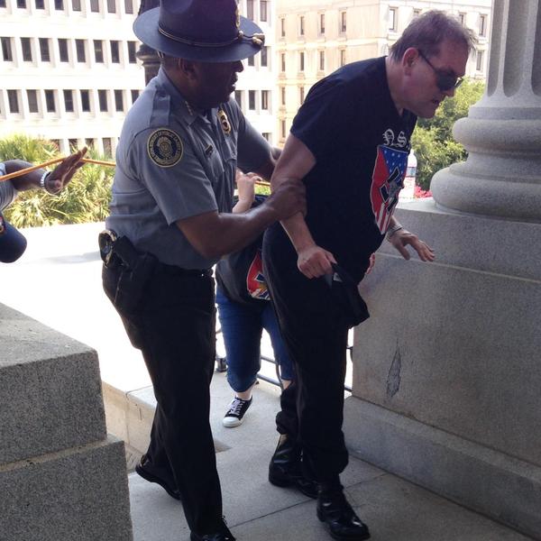 http://www.crimeandconsequences.com/crimblog/files/pictures/AssistingKlanProtester.jpg
